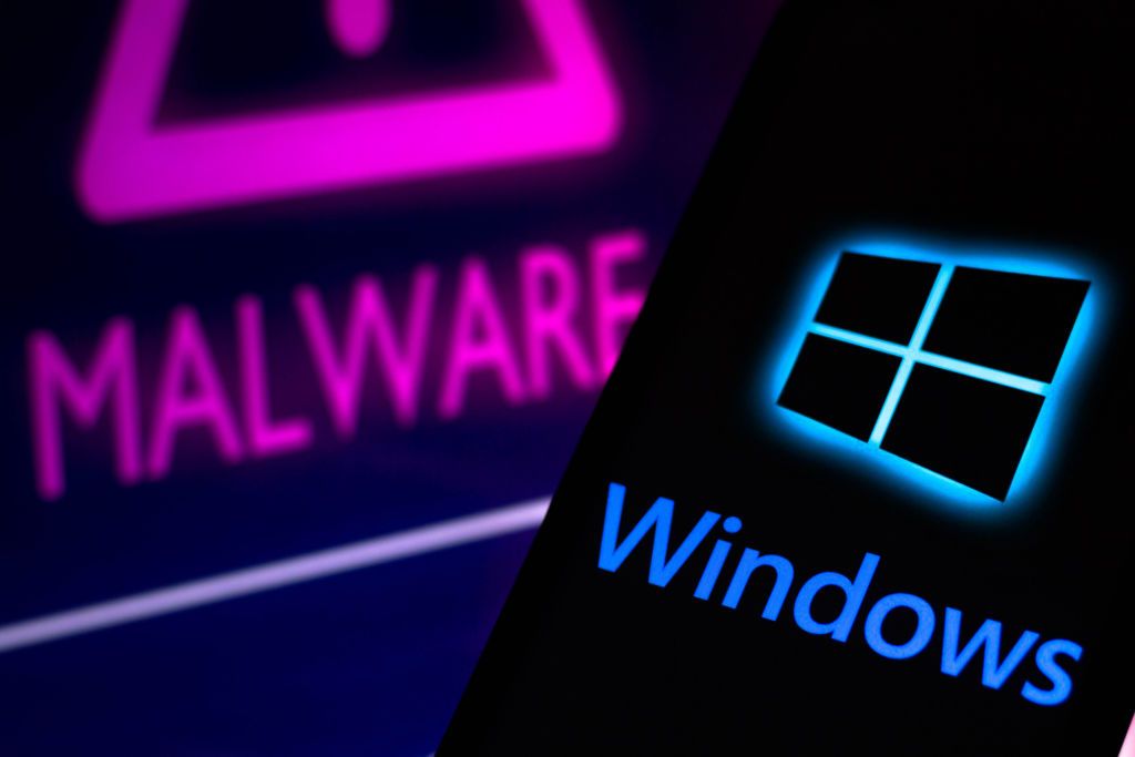 The Windows logo on a phone in front of a malware warning