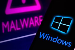 The Windows logo on a phone in front of a malware warning
