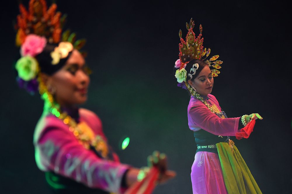 Dancers entertain the crowd at the Tour de Langkawi team presentation