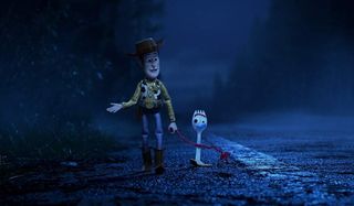 Toy Story 4 Woody and Forky walking down the highway