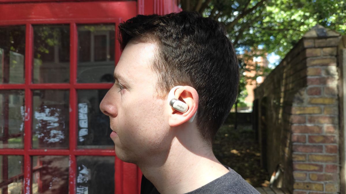 Shokz OpenFit 2 on a wooden table