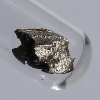 A square centimeter of ultrapure cerium in a vial of argon, about 1.5 grams.