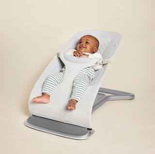 Cute baby in the ErgoBaby Evolve Bouncer