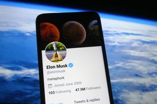 Elon Musk on his phone.