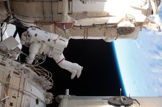 With various components of the International Space Station in the view, NASA astronauts Andrew Feustel and Michael Fincke (not pictured) conduct STS-134 mission's third spacewalk. It took place on May 25, 2011 (Flight Day 10).