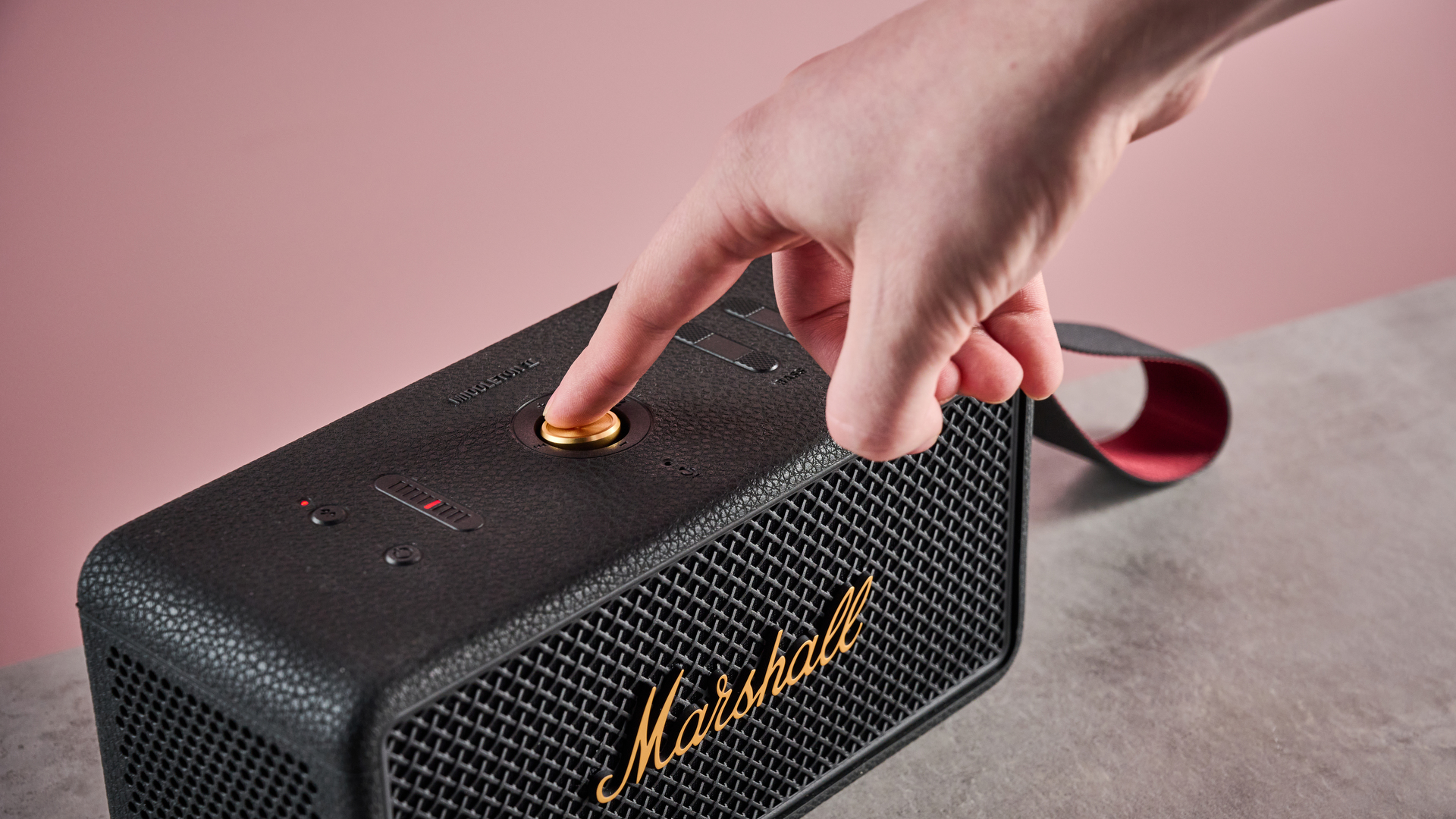 Man pressing button on the Marshall Middleton II