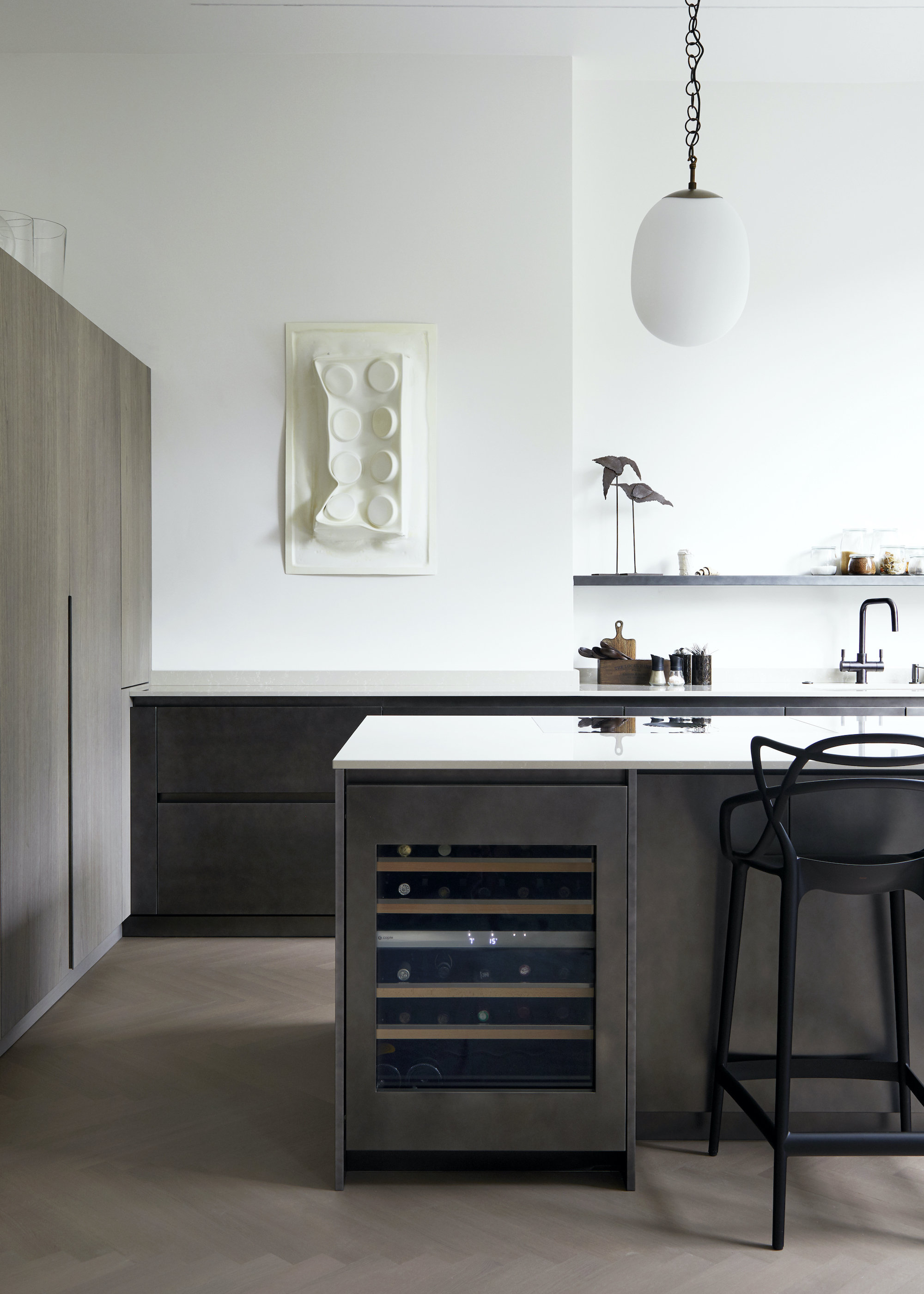 Kitchen with wood island and white walls