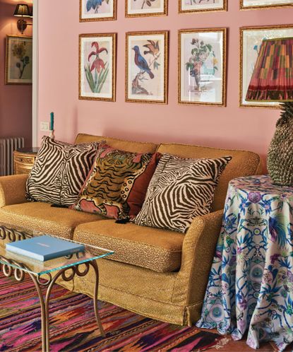 Maximalist living room with colorful wall art and layered textiles