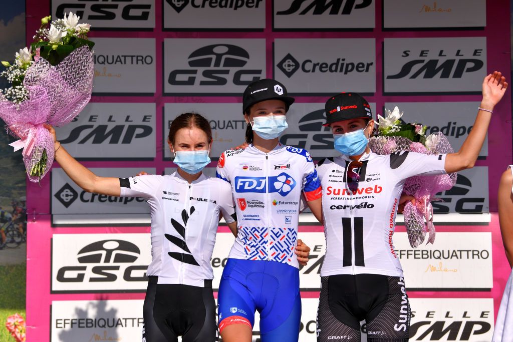 MOTTAMONTECORVINO ITALY SEPTEMBER 19 Podium Niamh FisherBlack of New Zealand and Team Paule Ka Evita Muzic of France and Team FDJ Nouvelle Aquitaine Futuroscope Juliette Labous of France and Team Sunweb Celebration Mask Covid safety measures Flowers during the 31st Giro dItalia Internazionale Femminile 2020 Stage 9 a 1099km stage from Motta Montecorvino to Motta Montecorvino 645m GiroRosaIccrea GiroRosa on September 19 2020 in Motta Montecorvino Italy Photo by Luc ClaessenGetty Images