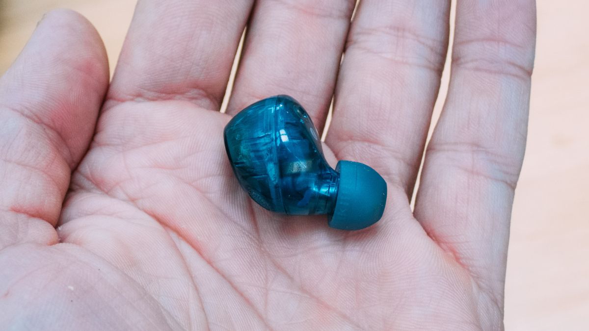 A Sony WF-C710N earbud in the palm of a hand