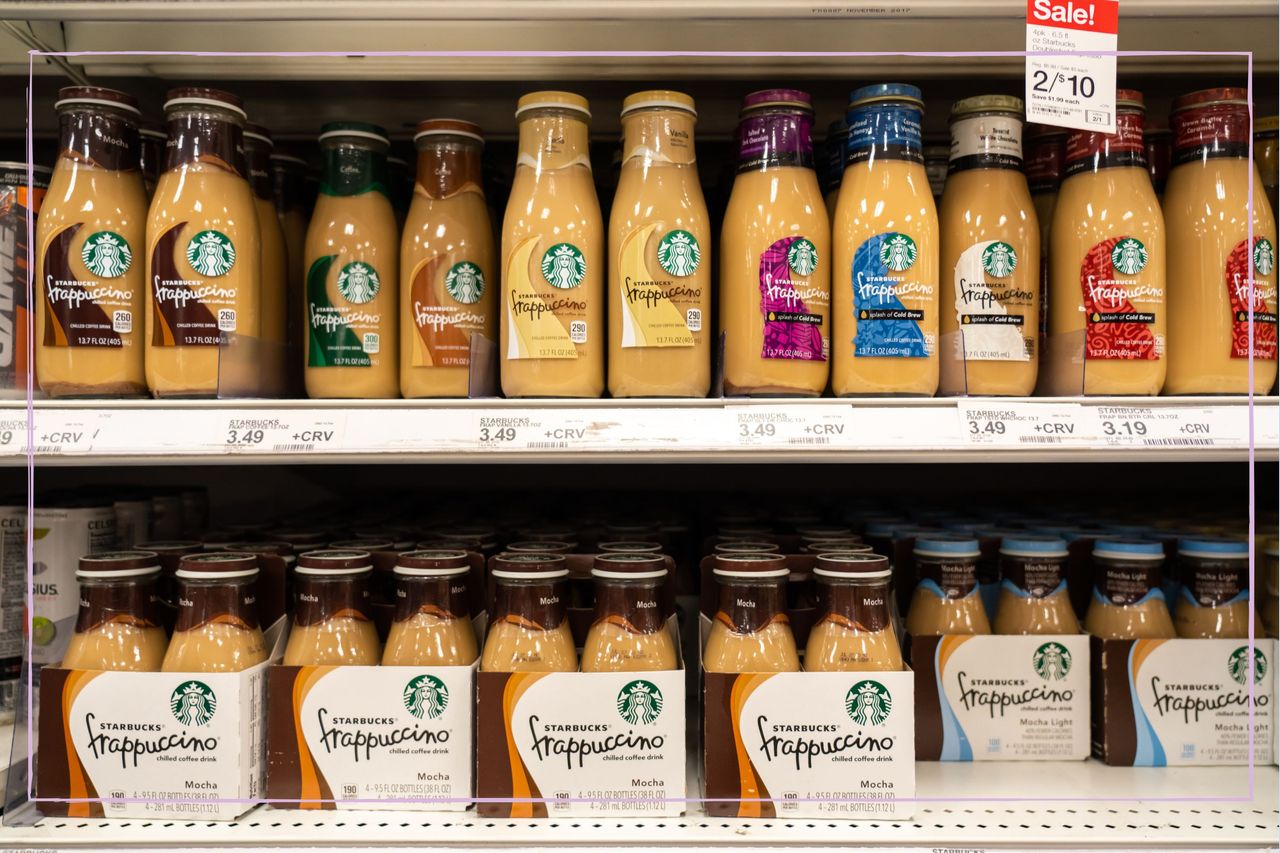 Starbucks Frappuccino bottles on a shelf in a supermarket