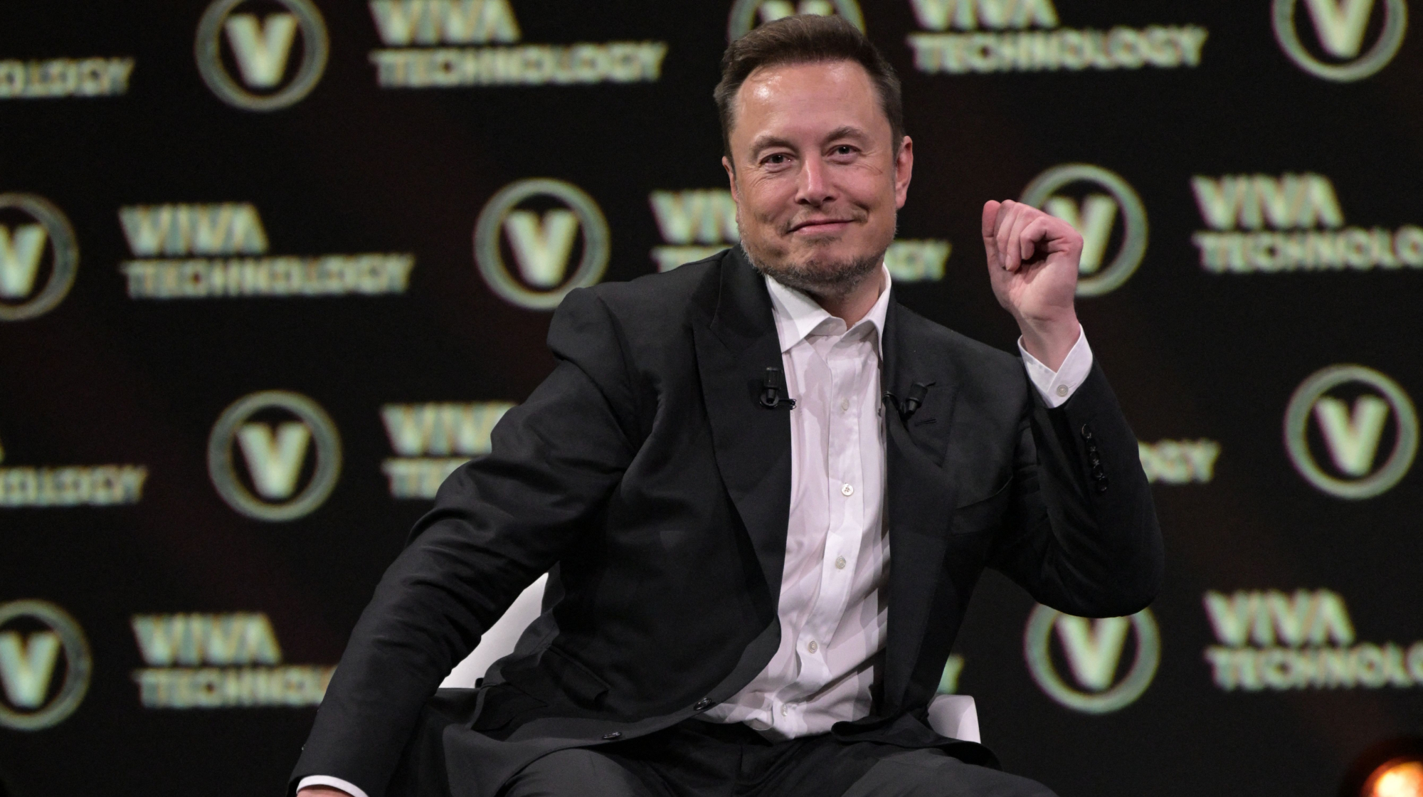 SpaceX, Twitter and electric car maker Tesla CEO Elon Musk reacts as he speaks during his visit at the Vivatech technology startups and innovation fair at the Porte de Versailles exhibition center in Paris, on June 16, 2023. 
