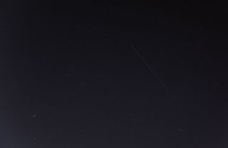 This photo of China's Tiangong-1 space station module streaking overhead was captured by Gianluca Masi of the Virtual Telescope Project in Rome on March 9, 2018. The spacecraft will fall to Earth between March 30 and April 1. The constellations Orion, Auriga and Taurus are also visible.