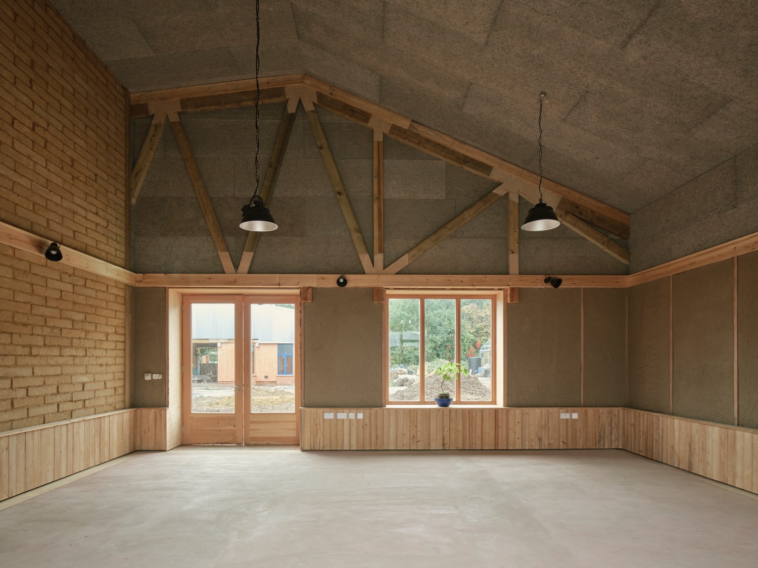 Wolves Lane Centre interior of space made of brick, earth and wood