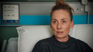 Holby City's Jac Naylor in a hospital bed. 