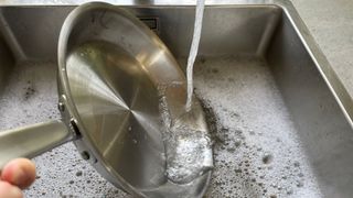 Made In 10-piece Stainless Steel Pan Set frying pan being washed up