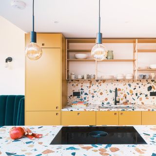 colourful kitchen with terrazzo island countertop, kitchen island with hob