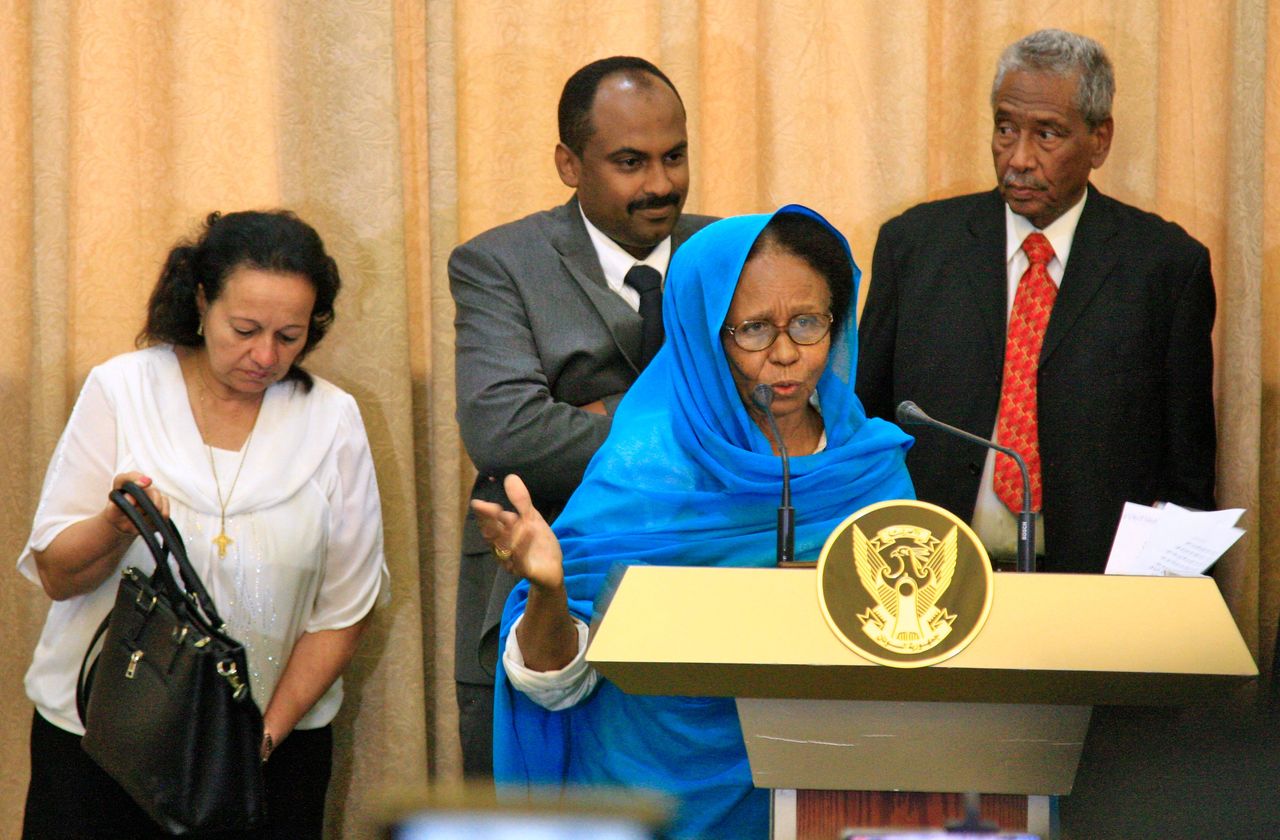 Aisha Mousa (front), Raja Nicolas Abdel Massih (L), Mohamed al-Fakki Suleiman (C, behind), and Hassan Sheikh Idris (R).