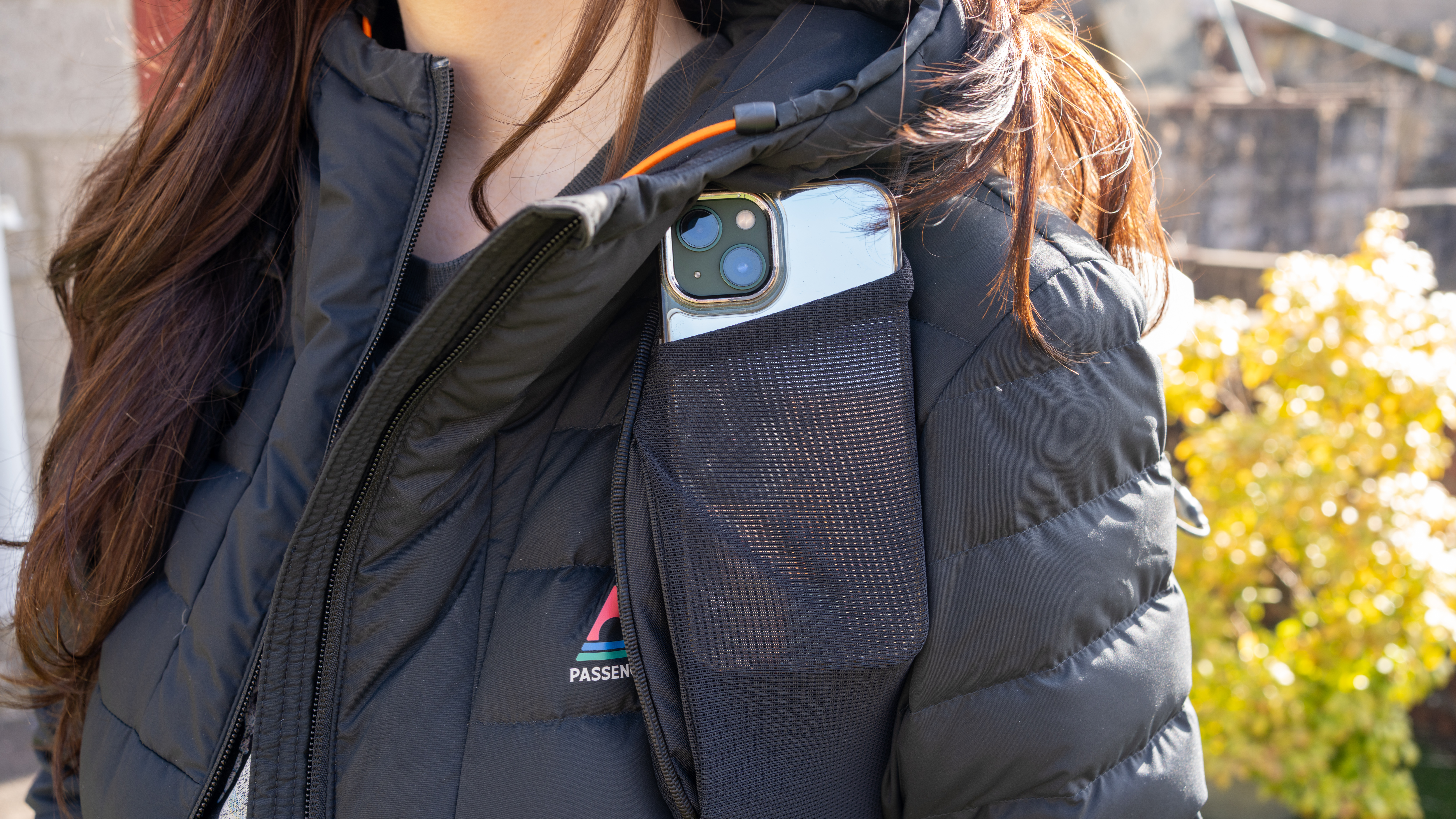 cellphone inside the mesh pouch on the strap of the peak design outdoor bag