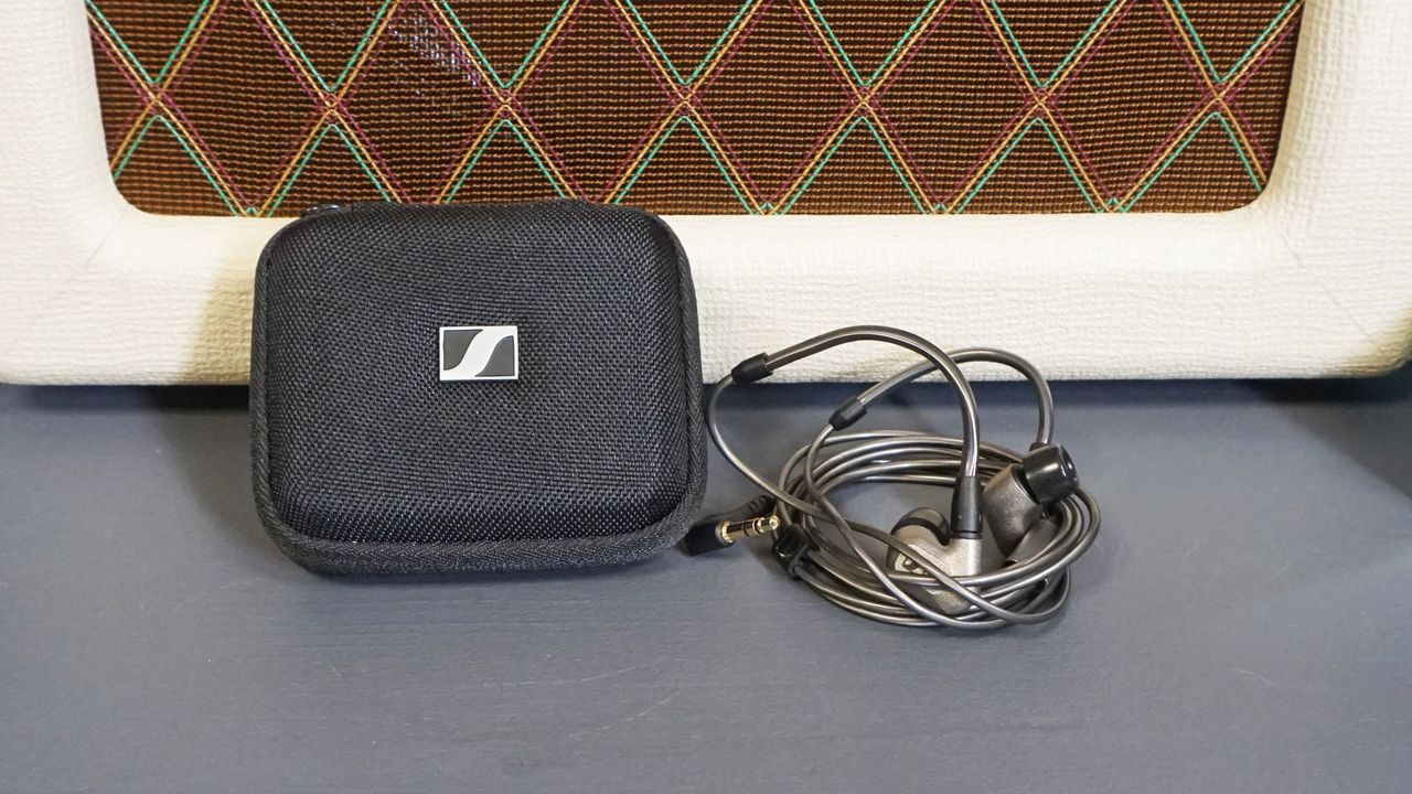 Sennheiser IE 600 next to gray/black carry case