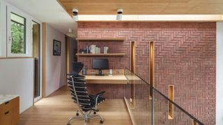 modern home office with exposed brick walls on landing