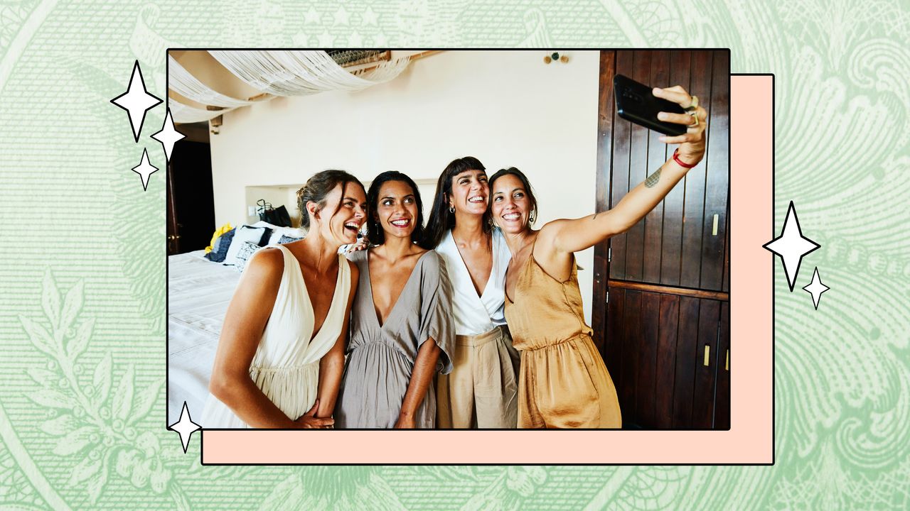 A newlywed couple takes a selfie with two of their guests.