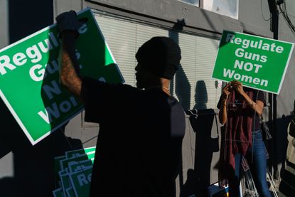 Volunteers organize abortion rights lawn signs during a 2022 campaign event for Senator Raphael Warnock