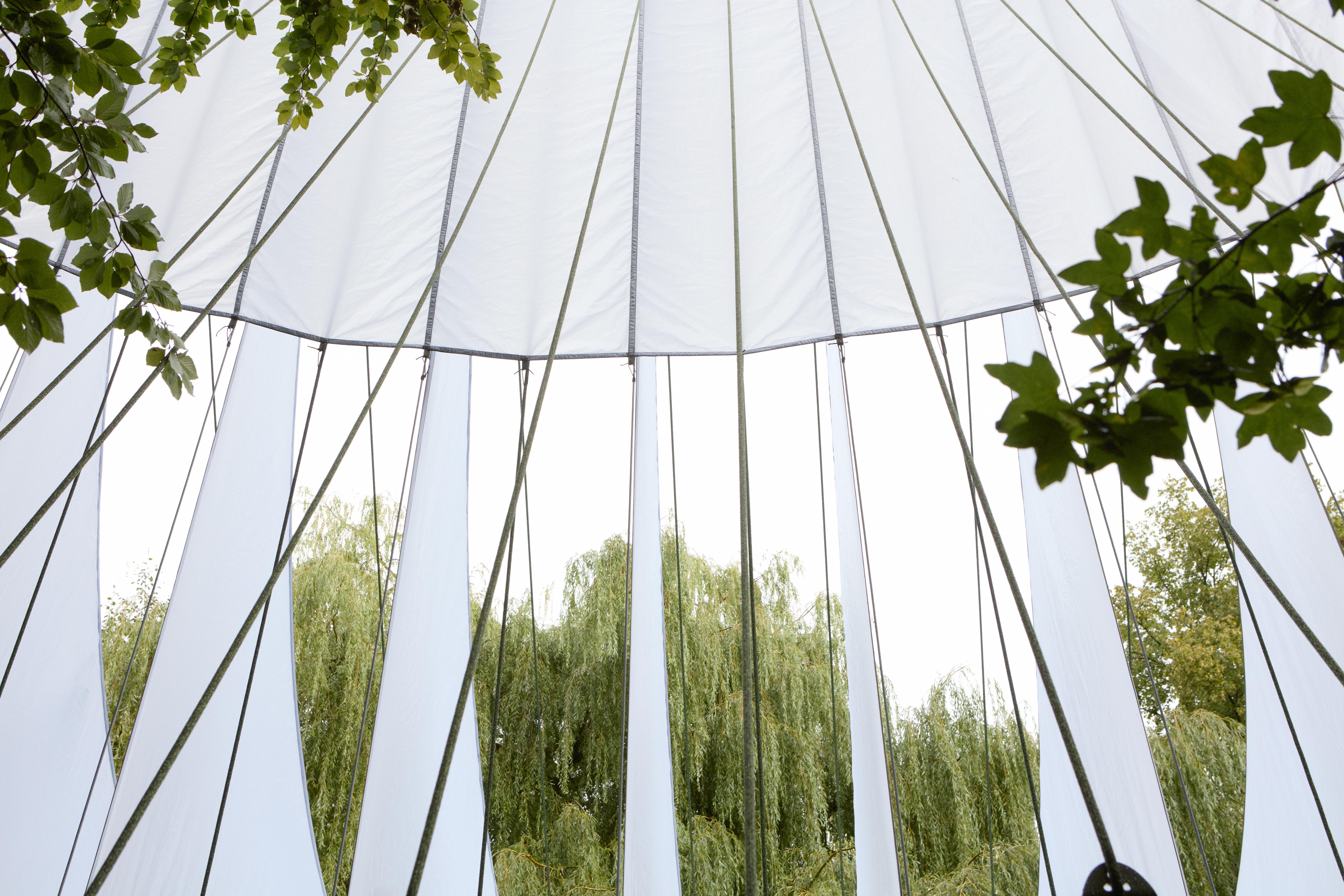 At Dekmantel Festival, a white tent over a stage in the woods