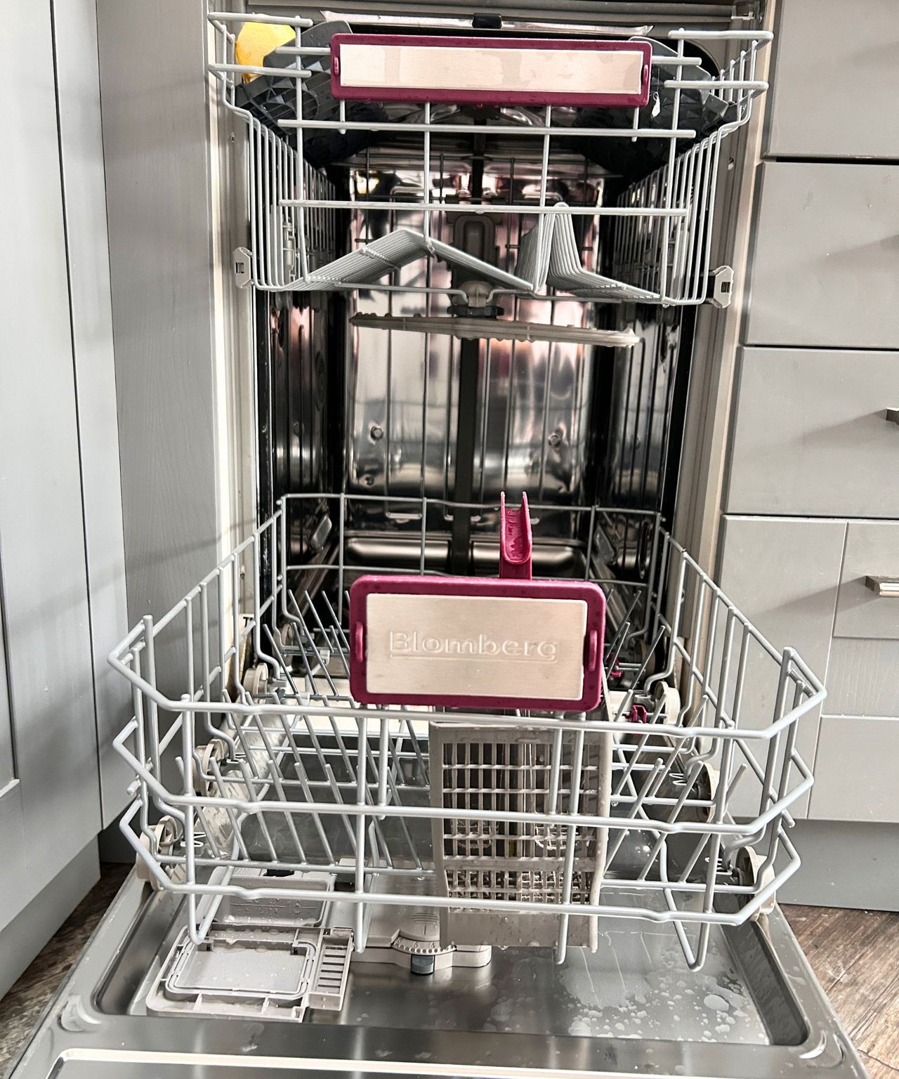 Empty dishwasher having taken out all of the clean dishes