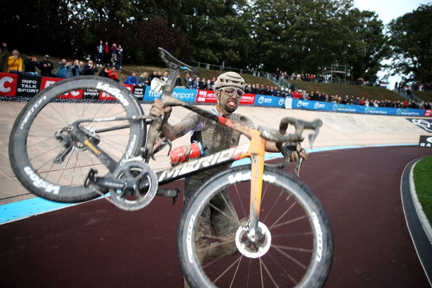 ROUBAIX, FRANCE - OCTOBER 03: Sonny Colbrelli of Italy and Team Bahrain Victorious covered in mud celebrates winning in the Roubaix Velodrome - Vélodrome André Pétrieux after the 118th Paris-Roubaix 2021 - Men&#039;s Eilte a 257,7km race from Compiègne to Roubaix / #ParisRoubaix / on October 03, 2021 in Roubaix, France. (Photo by Etienne Garnier - Pool/Getty Images)