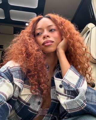 Ravyn Lenae with terracopper hair colour