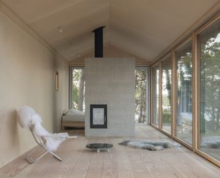 Open plan interior of Swedish cabin in woods