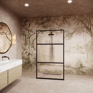 A walk-in shower with a wall mural and a black-framed glass panel with fluted glass