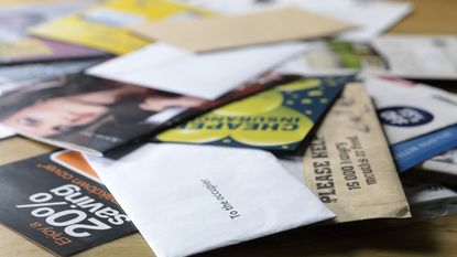 pile of junk mail for IRS unclaimed refund scam