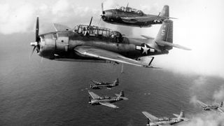 U.S. Navy Grumman Avengers torpedo bombers flying from the USS Intrepid in 1944.