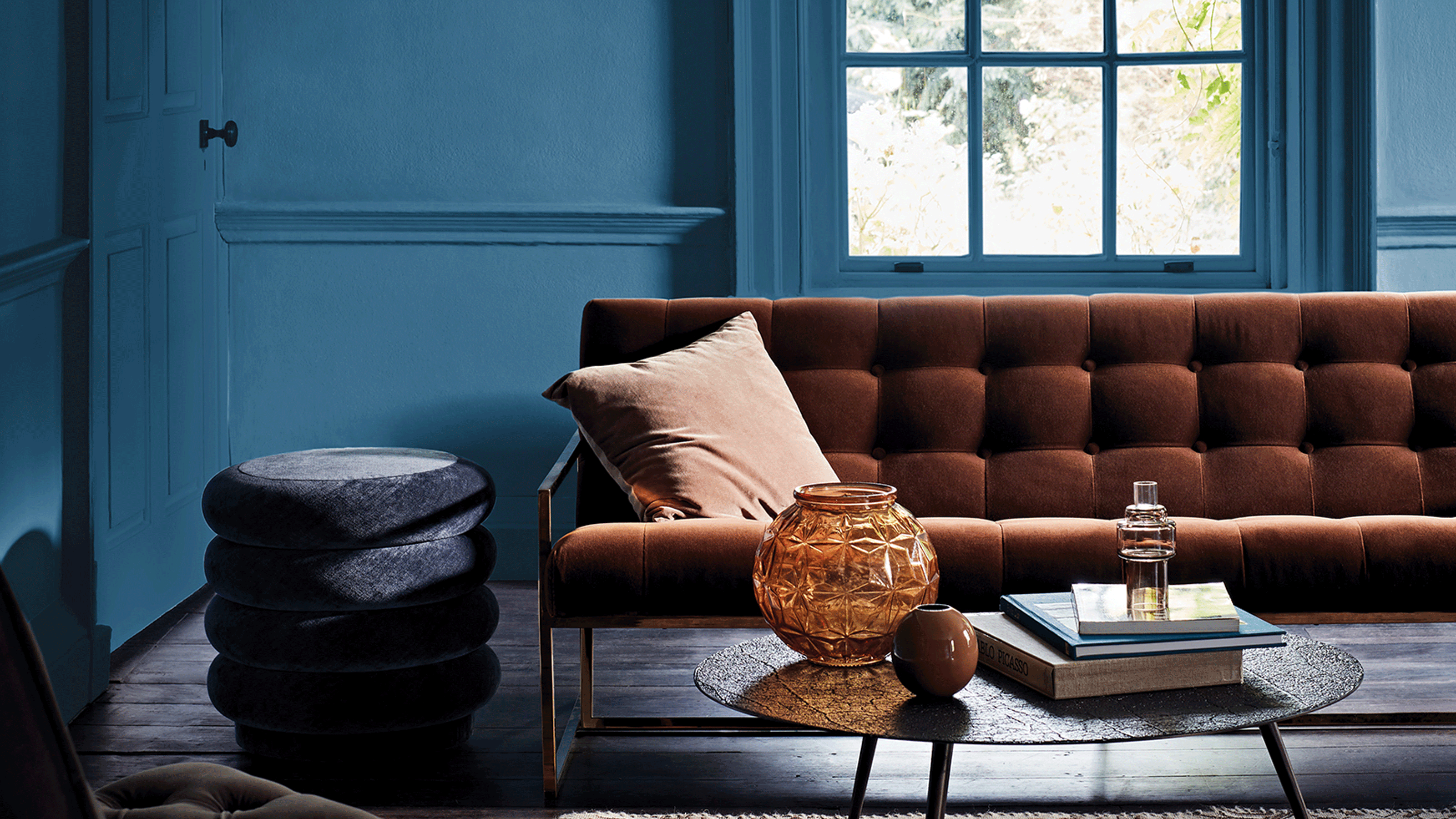 Blue living room with leather sofa