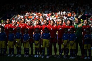 Wales women line-up before their opening Euro 2025 game against the Netherlands