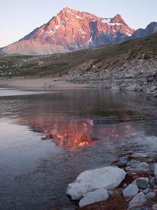 At sunset, the normally gray Meson Alto, the mountain that dominates the view to the east of Laguna Negra, glows with color.