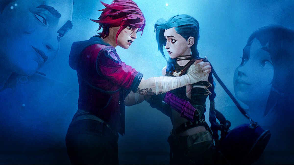 Two people stand in the centre of the frame. The one on the left, Vi, is slightly taller and has short pink hair. Her hands are wrapped with white tape. She is holding onto the shoulder of her sister, Jinx. She has long blue hair in two braids and is wearing a black crop top.