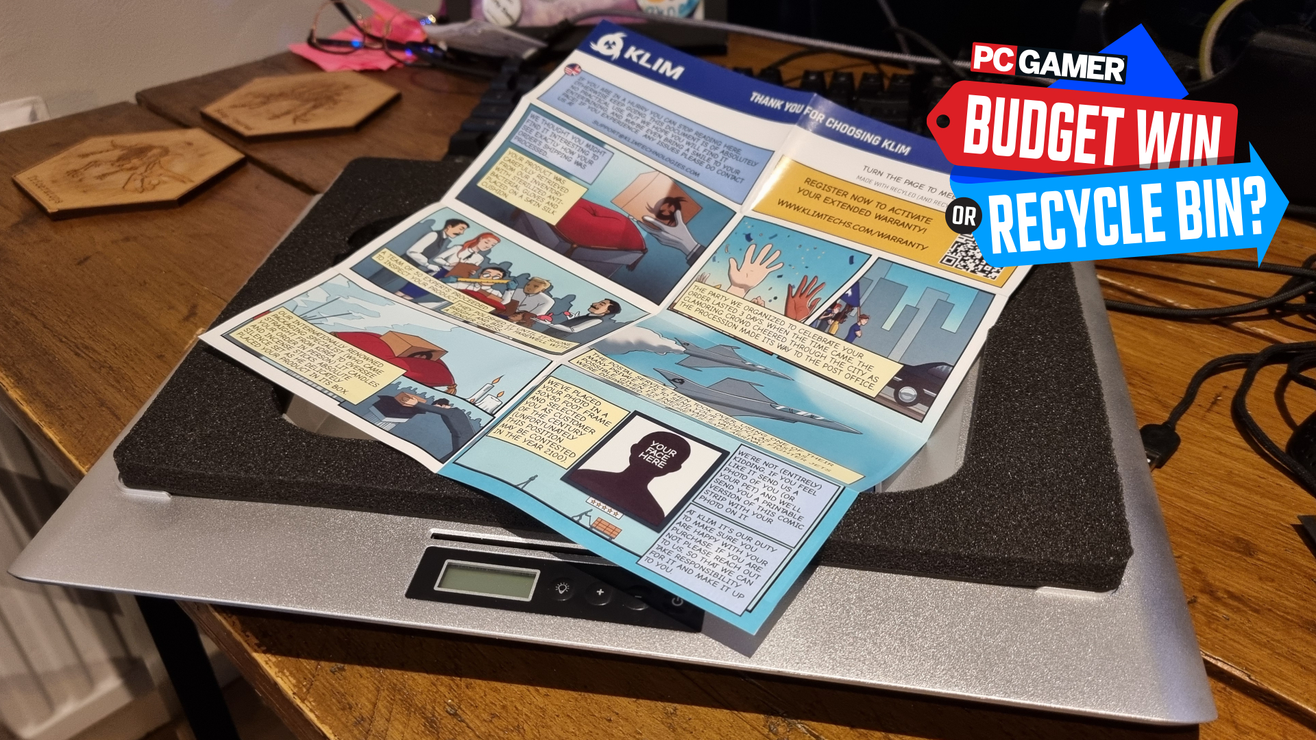 A Klim Everest laptop cooler with a comic strip on top of it