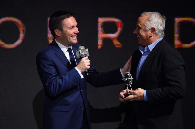 David Lappartient awards Greg LeMond the UCI President's Award at the 2019 UCI Gala in Guilin, China