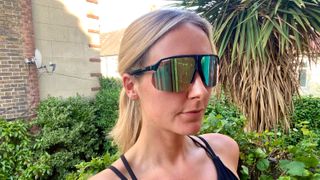 Tom's Guide writer Jessica wearing the Smith Motive Sunglasses