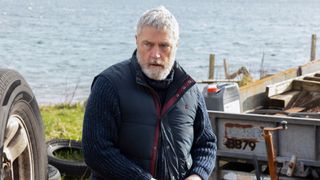 John Harris looking worried by the sea in Shetland season 9 episode 3