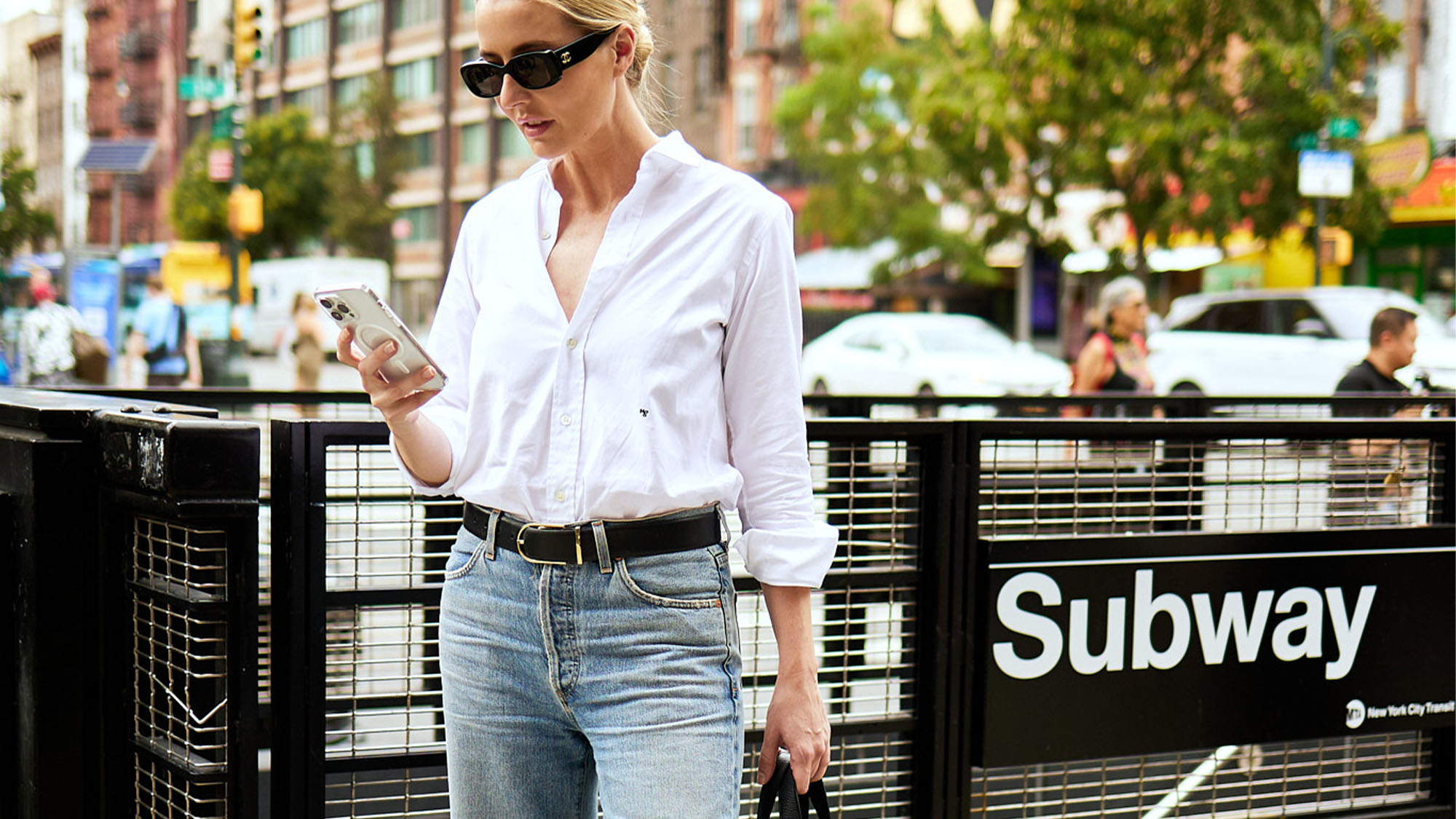 Who What Wear editor wears a white button-down and blue jeans in NYC