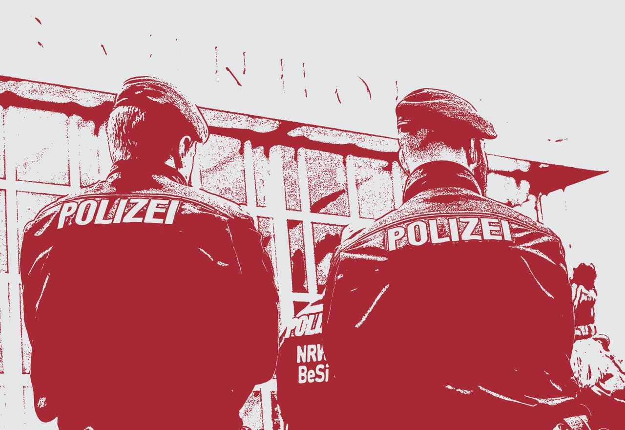 Police guard the train station in Cologne, Germany.