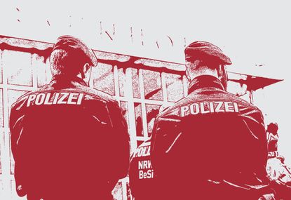 Police guard the train station in Cologne, Germany.