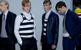 Male models wearing striped tops and suits from the Dior SS2015 collection