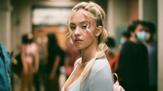 Sydney Sweeney as Cassie, in the hallway of the high school in a promotional photo for Euphoria season 2