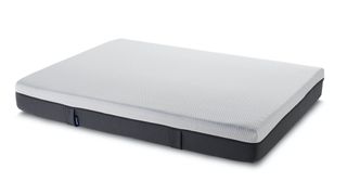 The Emma Original Mattress shown with a grey base and white top
