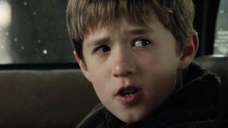 Haley Joel Osment sitting in a car in The Sixth Sense